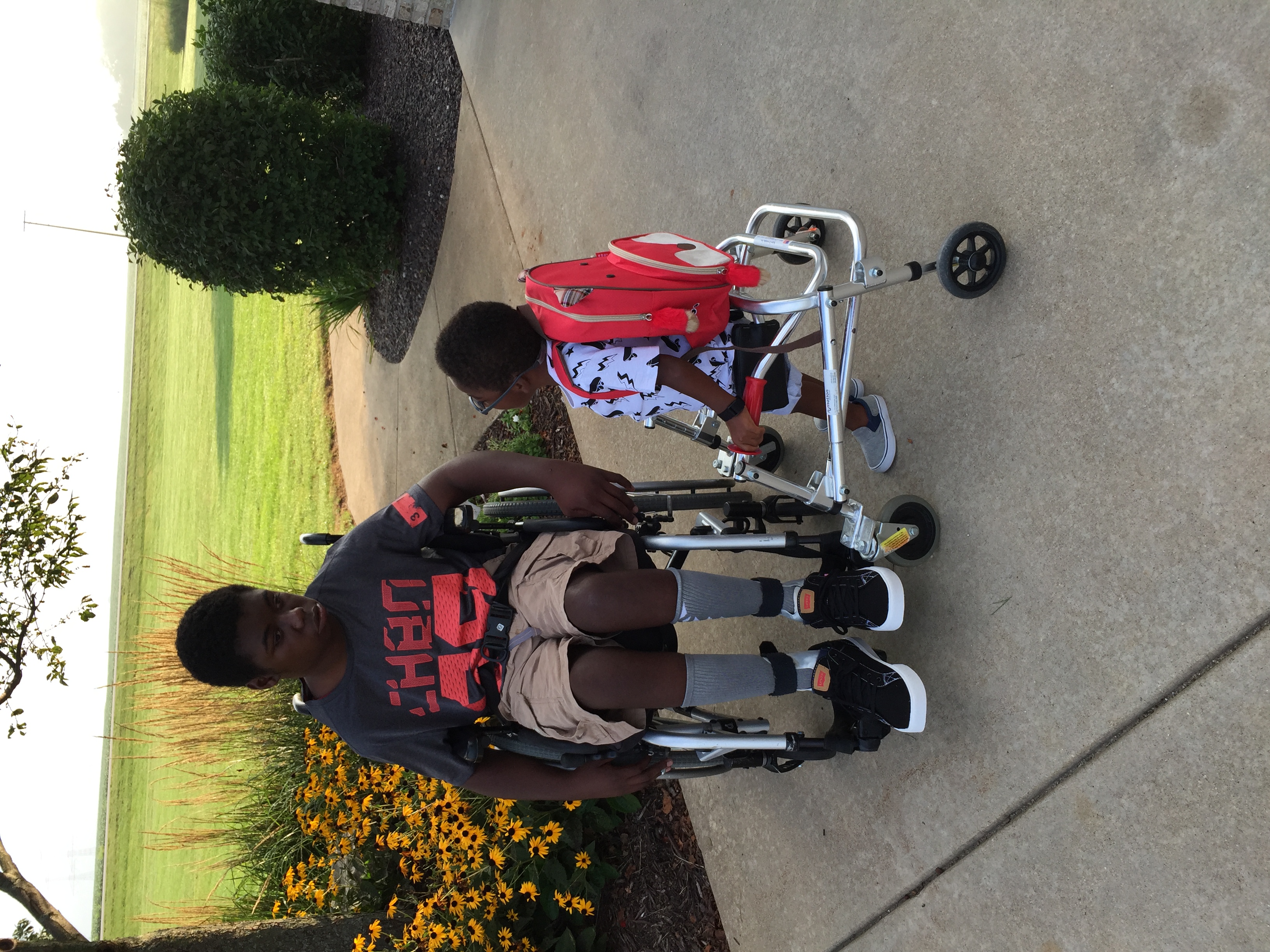 Moise and Kruz together in the driveway